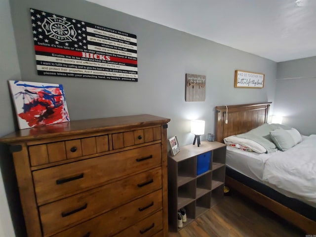 690 Redwood Dr, Piggott, AR 72454 - bedroom with dark wood finished floors