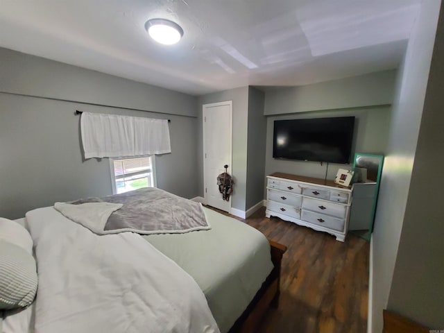 690 Redwood Dr, Piggott, AR 72454 - bedroom featuring wood finished floors and baseboards