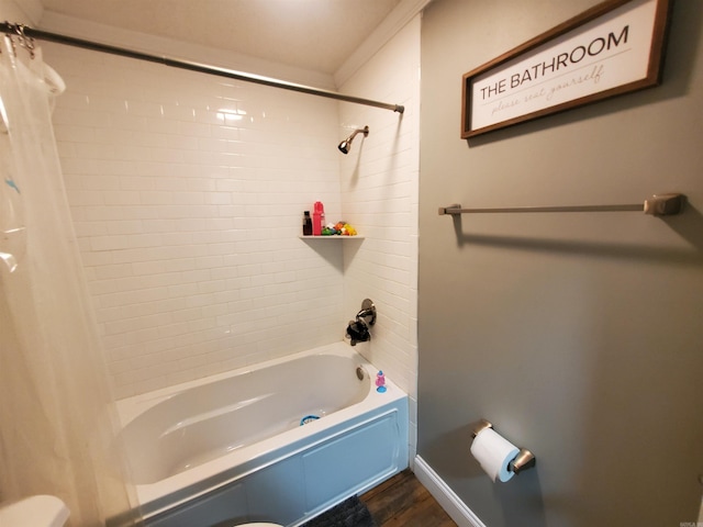 690 Redwood Dr, Piggott, AR 72454 - bathroom featuring wood finished floors and shower / tub combo