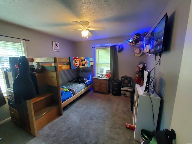 690 Redwood Dr, Piggott, AR 72454 - bedroom with multiple windows, carpet, a textured ceiling, and ceiling fan