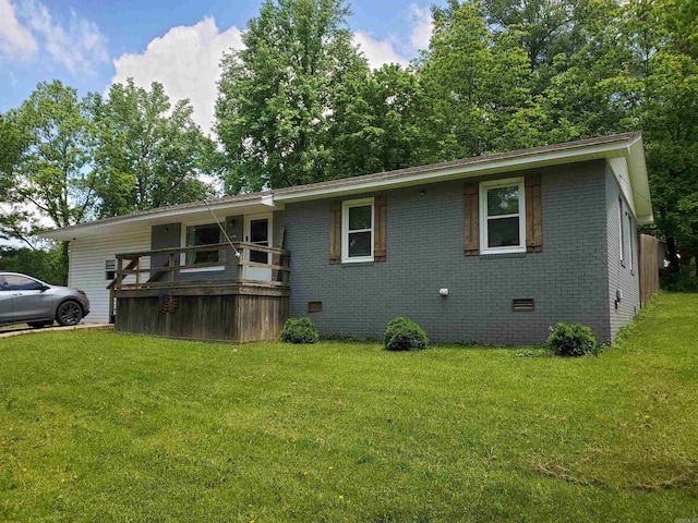 690 Redwood Dr, Piggott, AR 72454 - view of front facade featuring brick siding, crawl space, and a front yard