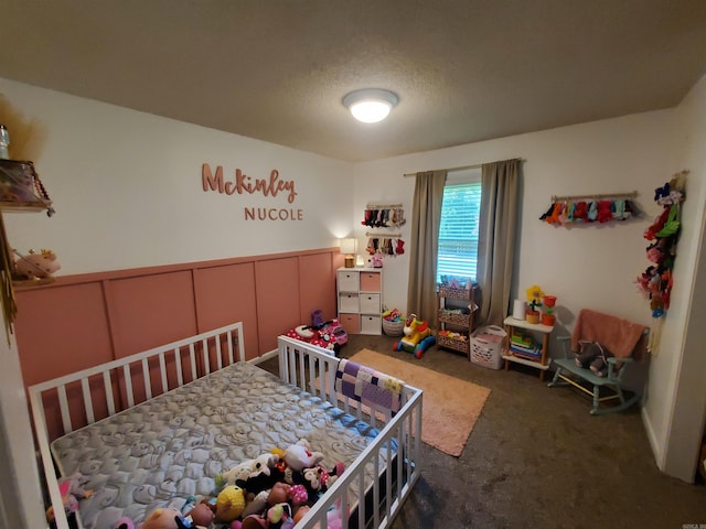 690 Redwood Dr, Piggott, AR 72454 - bedroom with carpet flooring, wainscoting, a decorative wall, and a nursery area