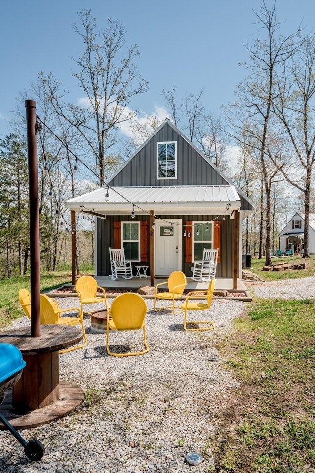 948 Sunny Slope Rd, Edgemont, AR 72044 - rear view of property featuring board and batten siding and covered porch