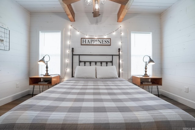 948 Sunny Slope Rd, Edgemont, AR 72044 - bedroom with dark wood finished floors, beam ceiling, and baseboards