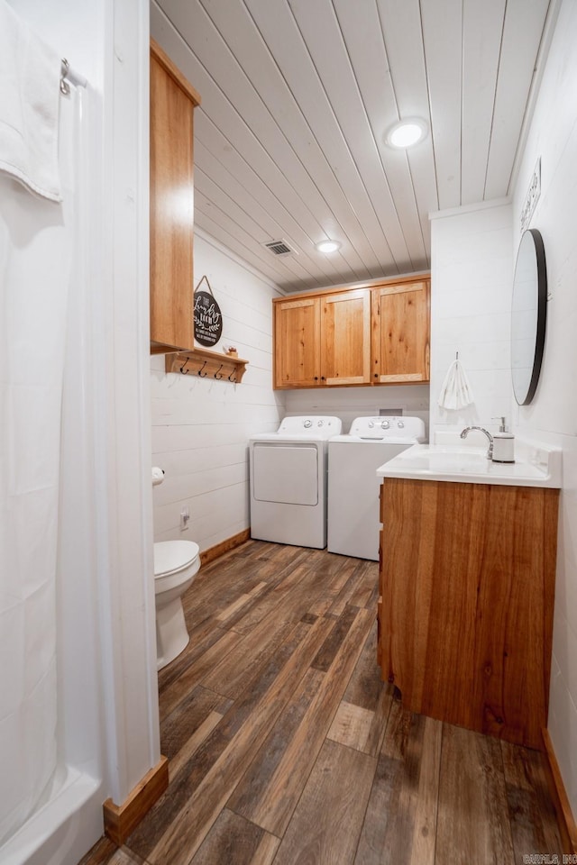 948 Sunny Slope Rd, Edgemont, AR 72044 - laundry room featuring separate washer and dryer, dark wood-type flooring, wooden ceiling, and wooden walls