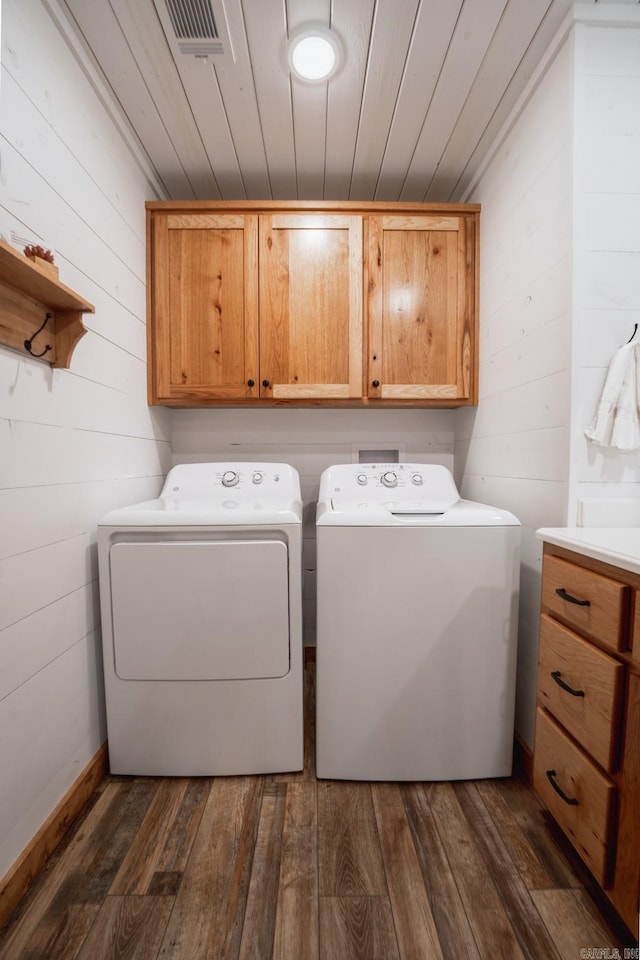948 Sunny Slope Rd, Edgemont, AR 72044 - laundry area featuring cabinet space, washer and dryer, dark wood finished floors, wood walls, and wood ceiling