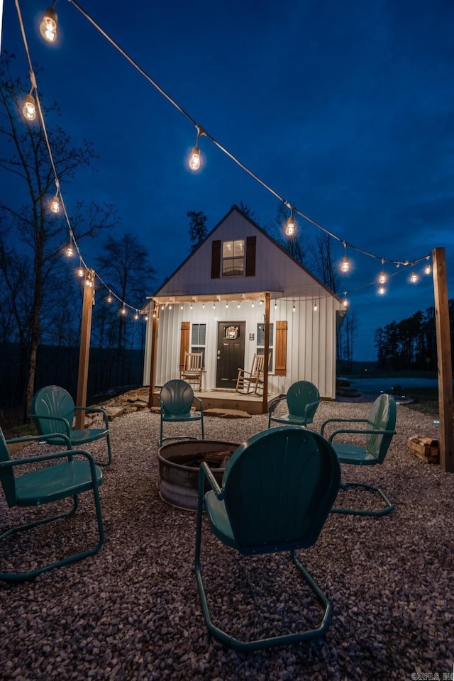 948 Sunny Slope Rd, Edgemont, AR 72044 - back of house at night with an outbuilding and fence