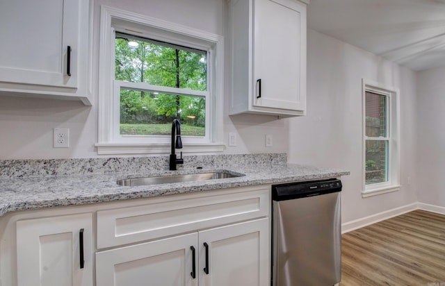 1114 Edgehill Dr, Benton, AR 72015 - kitchen with stainless steel dishwasher, a sink, wood finished floors, white cabinets, and light stone countertops