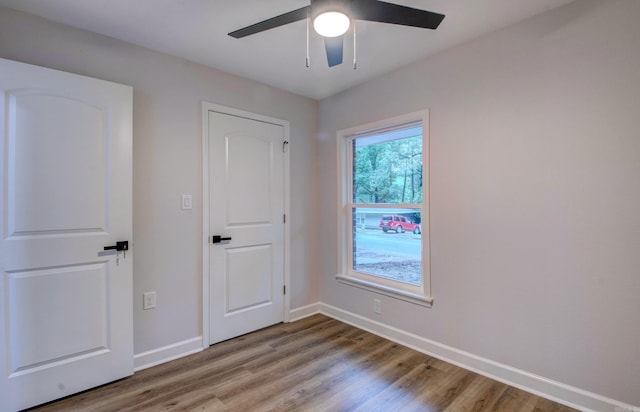 1114 Edgehill Dr, Benton, AR 72015 - unfurnished room featuring a ceiling fan, baseboards, and wood finished floors