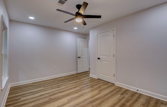 1114 Edgehill Dr, Benton, AR 72015 - unfurnished bedroom with light wood finished floors, baseboards, recessed lighting, and ceiling fan