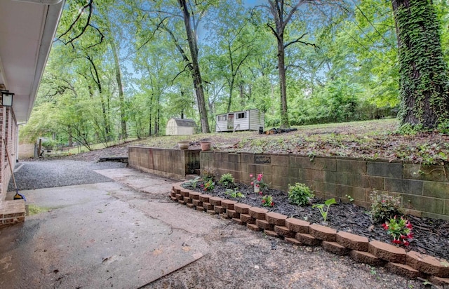 1114 Edgehill Dr, Benton, AR 72015 - view of yard featuring a storage shed, an outbuilding, and a patio