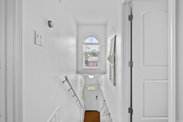 stairway featuring wood finished floors