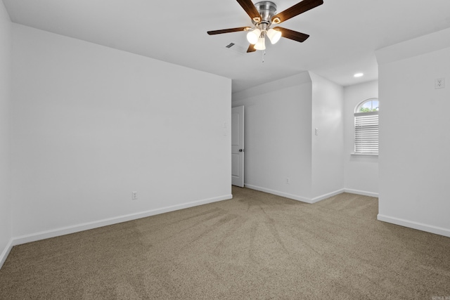 carpeted empty room with baseboards, a ceiling fan, and recessed lighting