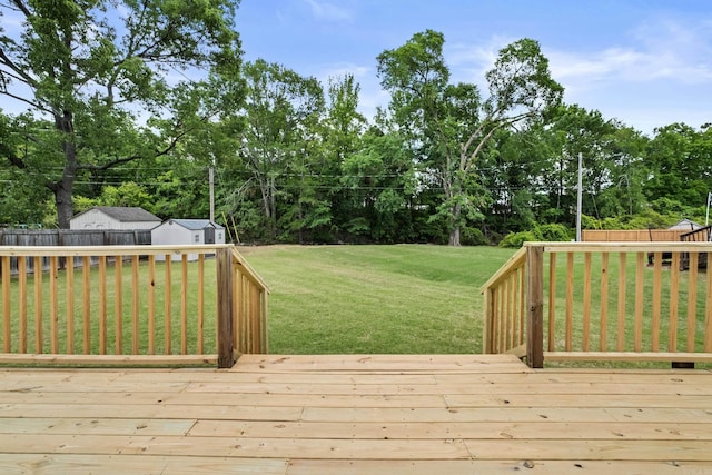 deck with an outbuilding and view of scattered trees