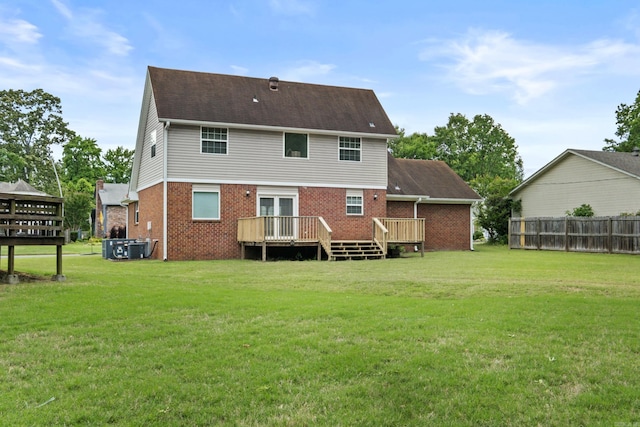 back of house with a wooden deck, brick siding, and french doors