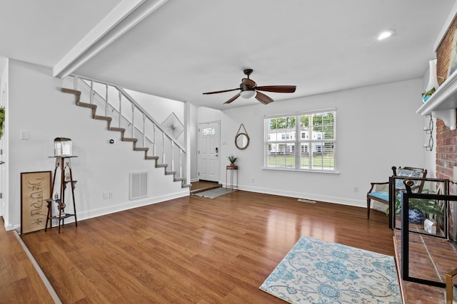 entryway with stairway, a ceiling fan, wood finished floors, baseboards, and recessed lighting