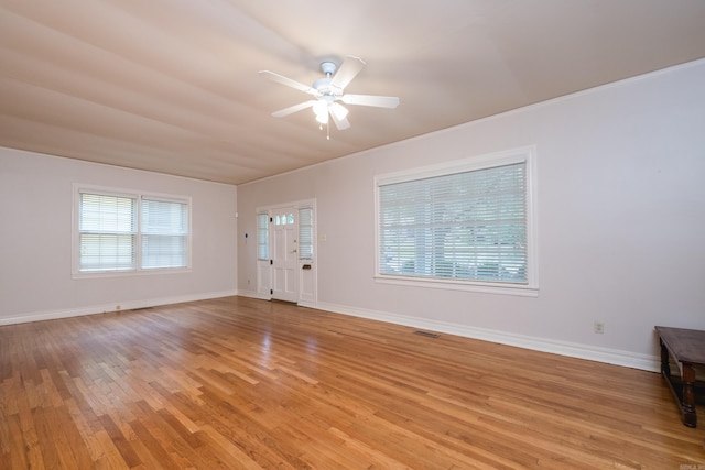 111 Thayer St, Little Rock, AR 72205 - unfurnished living room with a ceiling fan, light wood-style floors, and baseboards