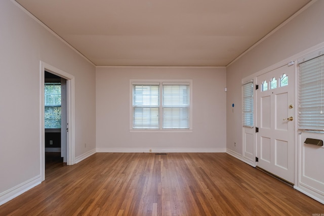 111 Thayer St, Little Rock, AR 72205 - foyer entrance with wood finished floors, plenty of natural light, crown molding, and baseboards