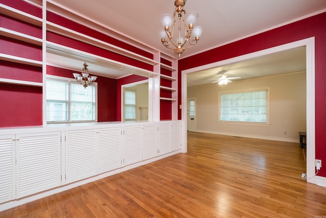 111 Thayer St, Little Rock, AR 72205 - unfurnished room featuring a chandelier, ornamental molding, wood finished floors, and baseboards