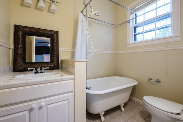 111 Thayer St, Little Rock, AR 72205 - full bathroom featuring a soaking tub, tile patterned flooring, toilet, vanity, and a shower with shower curtain