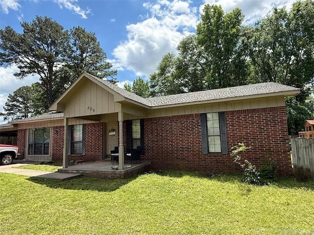 809 Walnut St, Dardanelle, AR 72834 - view of front of home featuring brick siding and a carport
