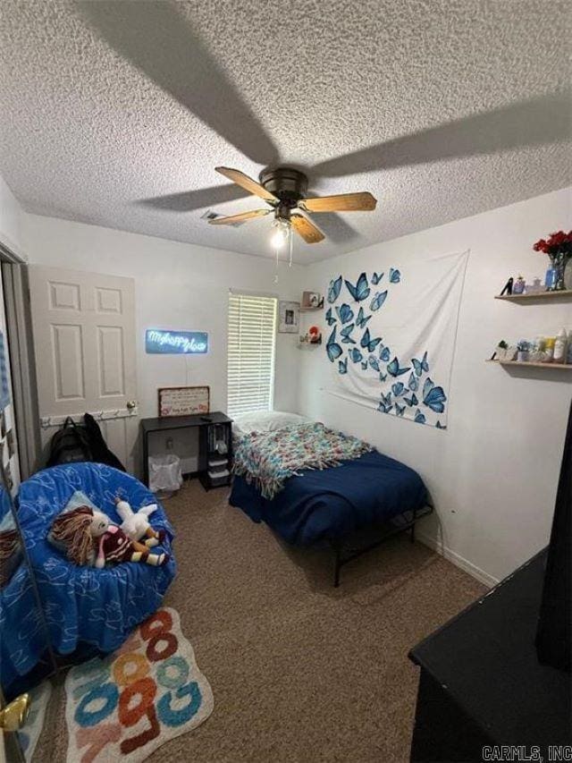 809 Walnut St, Dardanelle, AR 72834 - bedroom with a textured ceiling, carpet floors, a ceiling fan, and baseboards