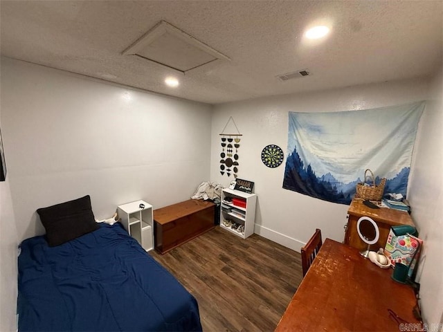 809 Walnut St, Dardanelle, AR 72834 - bedroom featuring wood finished floors, a textured ceiling, attic access, baseboards, and recessed lighting
