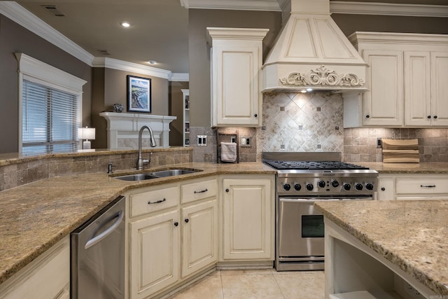 126 Manitou Dr, Maumelle, AR 72113 - kitchen with stainless steel appliances, custom range hood, a sink, light stone countertops, and crown molding