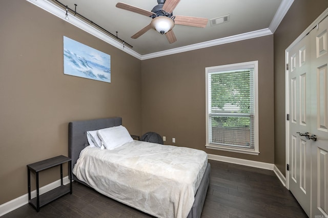 126 Manitou Dr, Maumelle, AR 72113 - bedroom with baseboards, crown molding, dark wood-style flooring, and a ceiling fan
