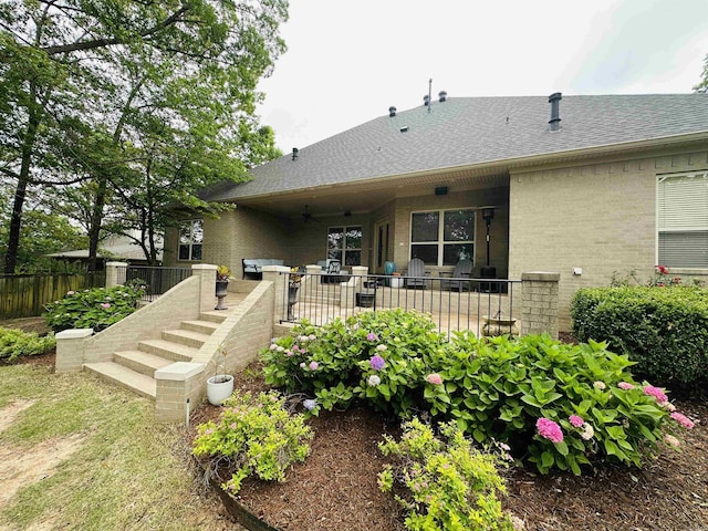 126 Manitou Dr, Maumelle, AR 72113 - back of house with ceiling fan, brick siding, a patio area, fence, and a shingled roof
