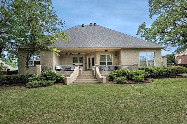 126 Manitou Dr, Maumelle, AR 72113 - rear view of house featuring a ceiling fan, brick siding, and a yard