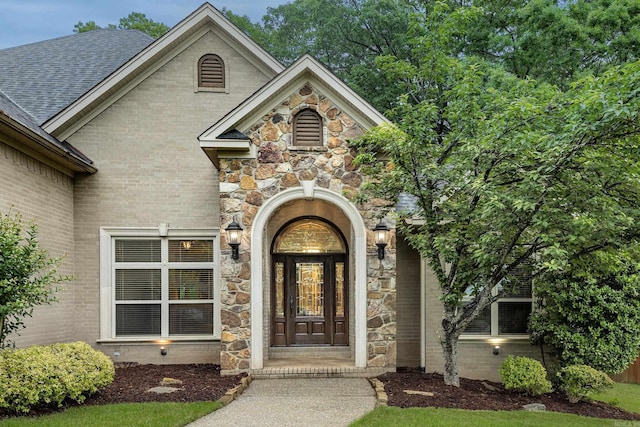 126 Manitou Dr, Maumelle, AR 72113 - property entrance with stone siding and brick siding