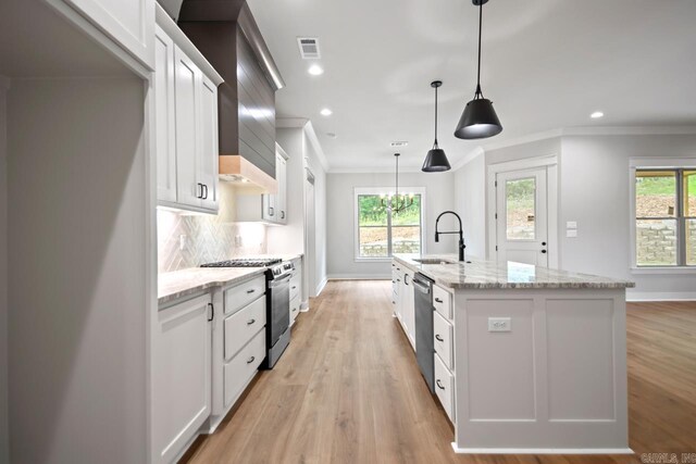 9313 Wooddale Dr, Sherwood, AR 72120 - kitchen with appliances with stainless steel finishes, a sink, healthy amount of natural light, crown molding, and baseboards