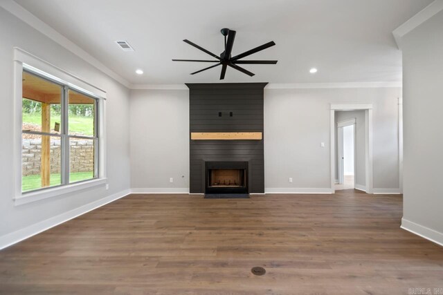 9313 Wooddale Dr, Sherwood, AR 72120 - unfurnished living room featuring ornamental molding, recessed lighting, a large fireplace, baseboards, and a ceiling fan