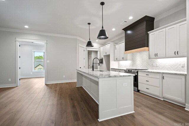 9313 Wooddale Dr, Sherwood, AR 72120 - kitchen with stainless steel gas range, a sink, crown molding, decorative backsplash, and recessed lighting