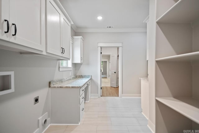 9313 Wooddale Dr, Sherwood, AR 72120 - washroom with hookup for an electric dryer, baseboards, recessed lighting, and cabinet space