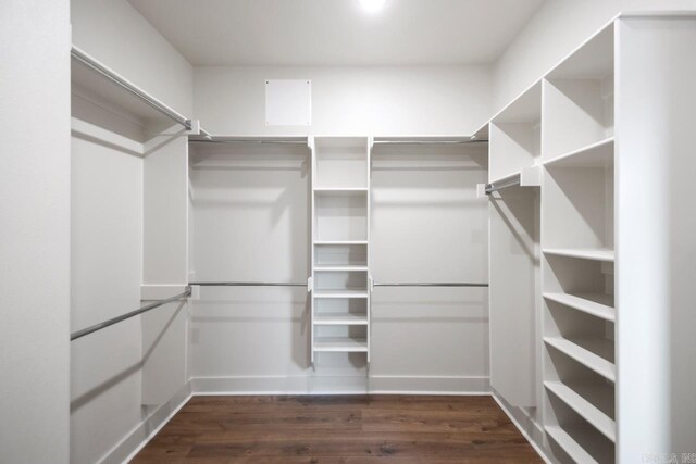 9313 Wooddale Dr, Sherwood, AR 72120 - walk in closet with dark wood-type flooring