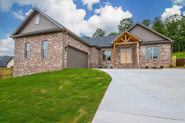 9313 Wooddale Dr, Sherwood, AR 72120 - craftsman house featuring board and batten siding, brick siding, concrete driveway, and a garage