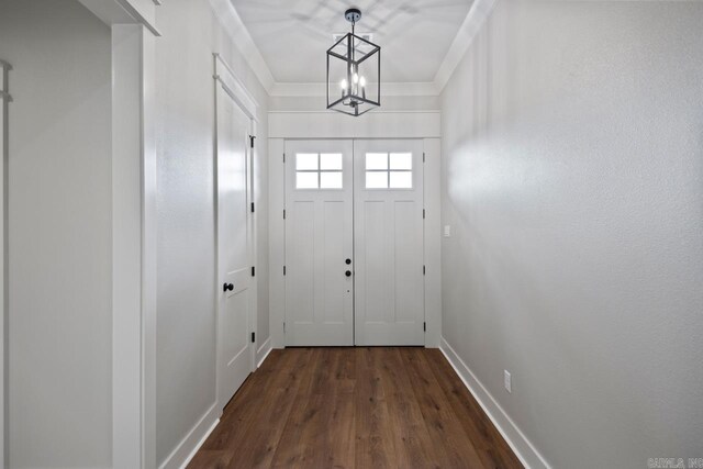 9313 Wooddale Dr, Sherwood, AR 72120 - entryway with a chandelier, dark wood-type flooring, and baseboards