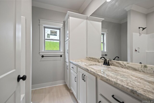 9313 Wooddale Dr, Sherwood, AR 72120 - full bathroom with vanity, baseboards, and a shower