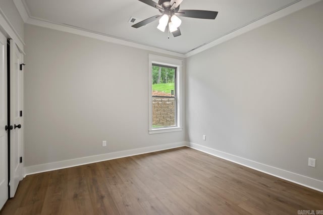 9313 Wooddale Dr, Sherwood, AR 72120 - empty room featuring ornamental molding, a ceiling fan, wood finished floors, and baseboards