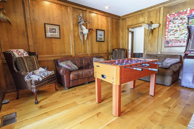 2005 Kingshighway, Weiner, AR 72479 - playroom with light wood-style floors and wood walls