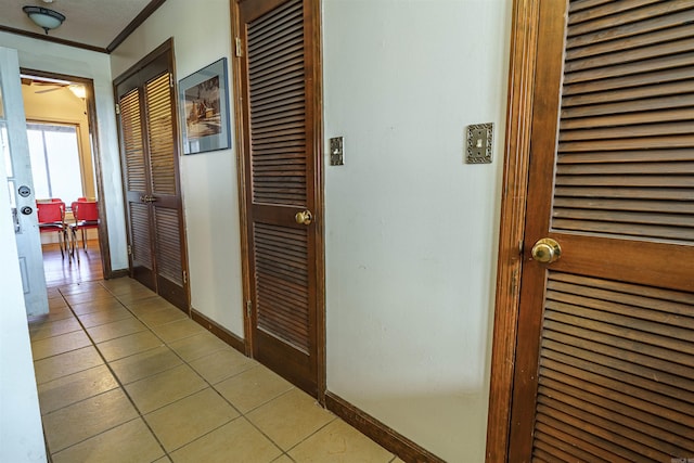 2005 Kingshighway, Weiner, AR 72479 - hallway with light tile patterned floors, baseboards, and crown molding