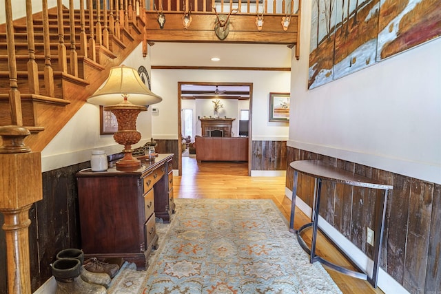 2005 Kingshighway, Weiner, AR 72479 - hallway featuring wainscoting, wood finished floors, and ornamental molding