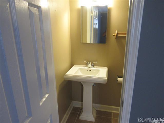 821 Mcadoo St, Little Rock, AR 72205 - bathroom featuring tile patterned floors and baseboards