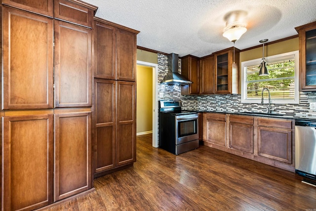 821 Mcadoo St, Little Rock, AR 72205 - kitchen featuring appliances with stainless steel finishes, wall chimney exhaust hood, a sink, tasteful backsplash, and dark wood-type flooring