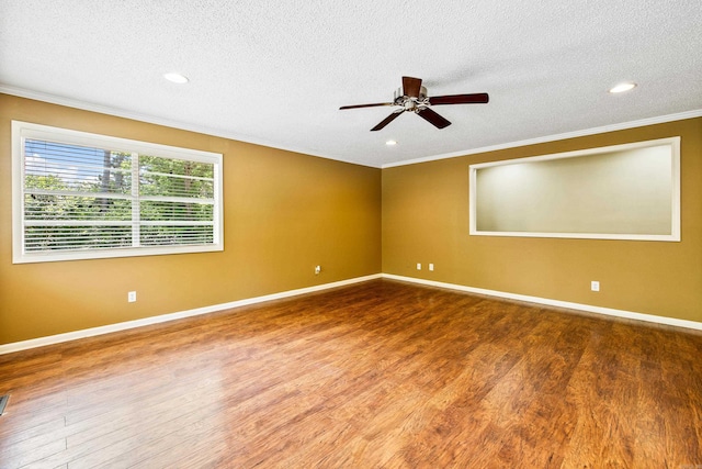 821 Mcadoo St, Little Rock, AR 72205 - spare room with ornamental molding, wood finished floors, a textured ceiling, ceiling fan, and baseboards