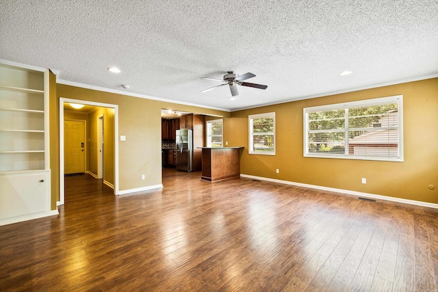 821 Mcadoo St, Little Rock, AR 72205 - unfurnished living room with crown molding, a ceiling fan, dark wood-style flooring, a textured ceiling, and baseboards