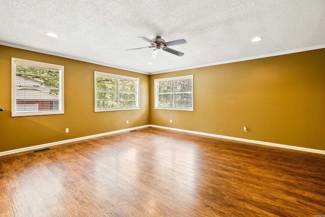 821 Mcadoo St, Little Rock, AR 72205 - empty room with crown molding, wood finished floors, ceiling fan, a textured ceiling, and plenty of natural light