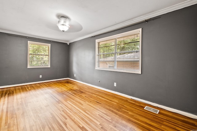 821 Mcadoo St, Little Rock, AR 72205 - spare room featuring ceiling fan, wood finished floors, crown molding, and baseboards